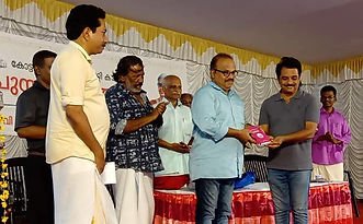 Prathapan Thayat with Director Sri Jayaraj and Sri Kureepuzha Sreekumar 